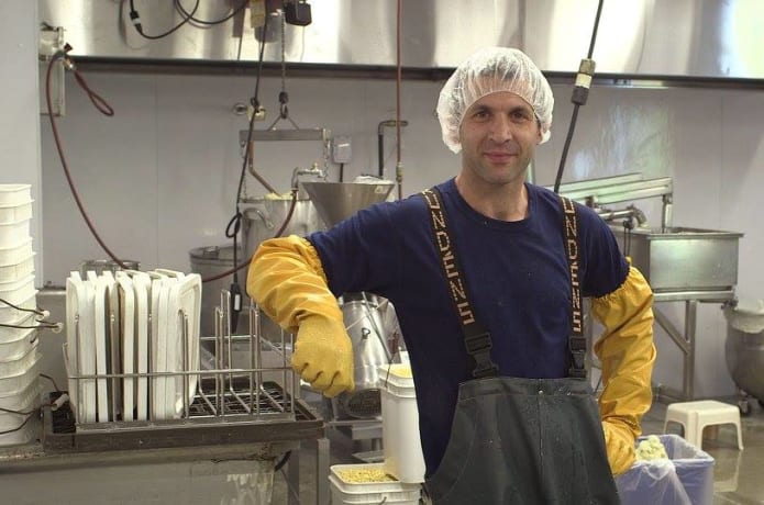 The tofu makers garb.  Designed for food safety and worker comfort.